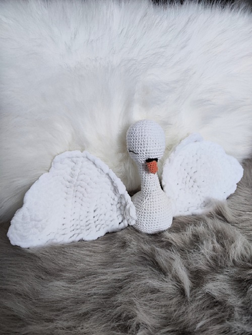 A cozy baby swan lovey